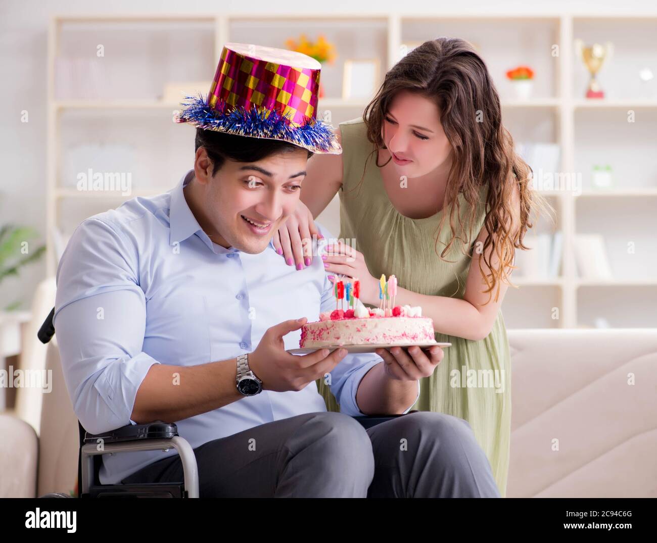 The Young Family Celebrating Birthday With Disabled Person Stock Photo ...