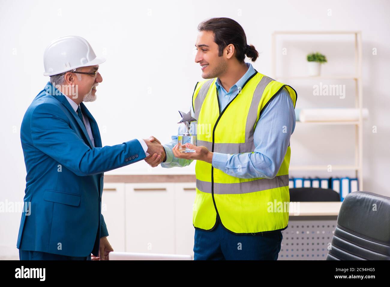 Two architects working in the office Stock Photo - Alamy