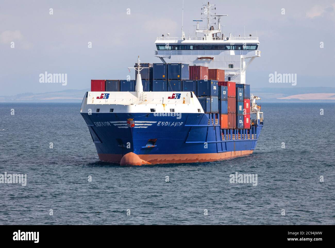 The container ship Endeavor, owned by the Dutch company JR Shipping Group, in the Firth of Clyde in south-west Scotland. Stock Photo