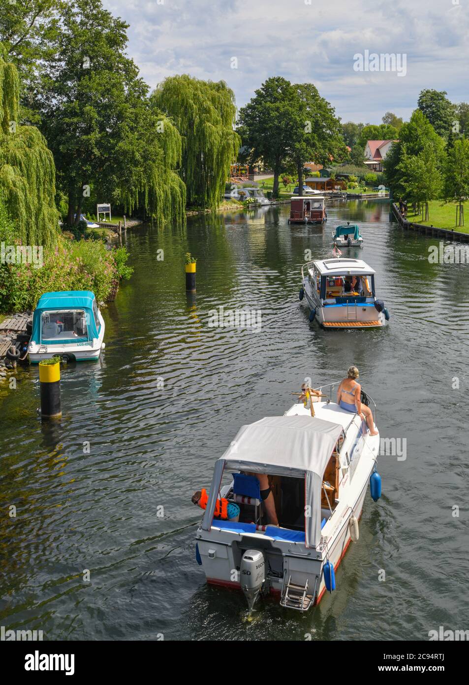 Wendisch Rietz, Germany. 28th July, 2020. Several boats are on a canal from the Great Storkow Lake towards the Scharmützel Lake. Credit: Patrick Pleul/dpa-Zentralbild/ZB/dpa/Alamy Live News Stock Photo