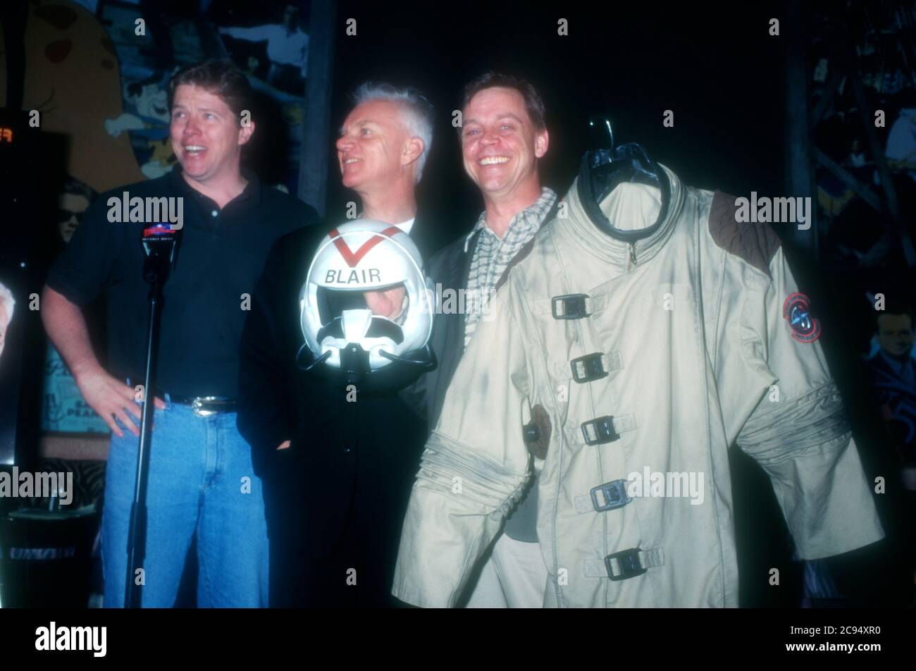 Los Angeles, California, USA 8th February 1996 (L-R) Actor Thomas F. Wilson, actor Malcolm McDowell and actor Mark Hamill attend Wings Commander 4 Costume Presentation on February 8, 1996 at Planet Hollywood in Los Angeles, California, USA. Photo by Barry King/Alamy Stock Photo Stock Photo