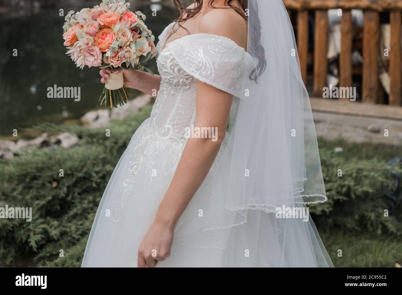 bride in wedding dress and with a bouquet Stock Photo - Alamy