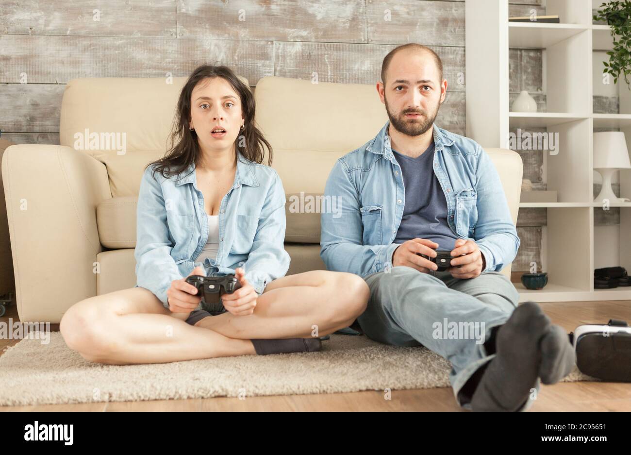 Young couple playing video games hi-res stock photography and images ...