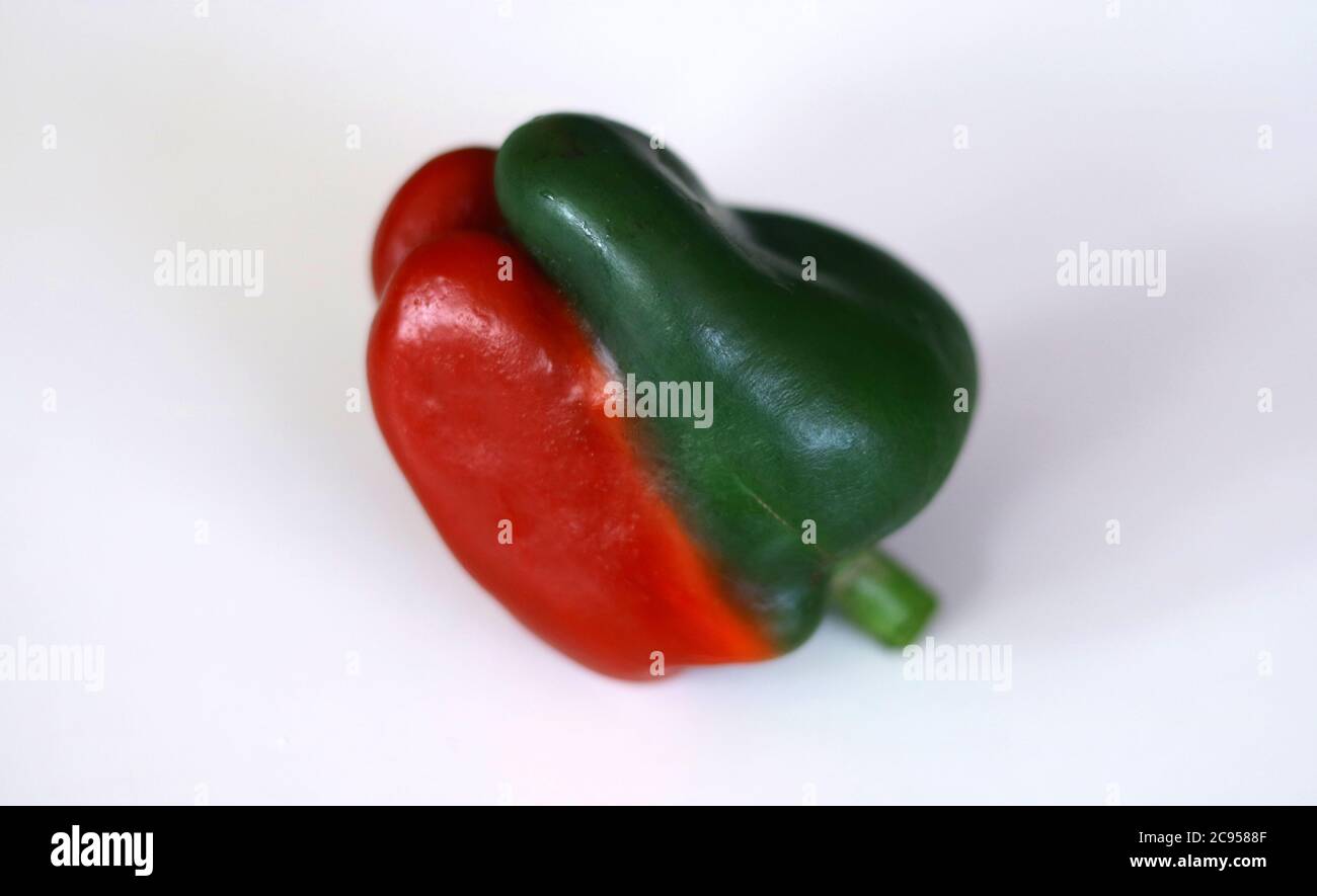 Two tone color paprika on white background. Stock Photo