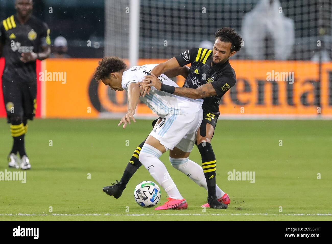 Orlando, Florida, USA. July 28, 2020: FC Cincinnati forward KEKUTA MANNEH (31) competes for the ball against Columbus Crew midfielder ARTUR (8) during the MLS is Back Tournament Columbus Crew SC vs Minnesota United FC match at ESPN Wide World of Sports Complex in Orlando, Fl on July 28, 2020. Credit: Cory Knowlton/ZUMA Wire/Alamy Live News Stock Photo