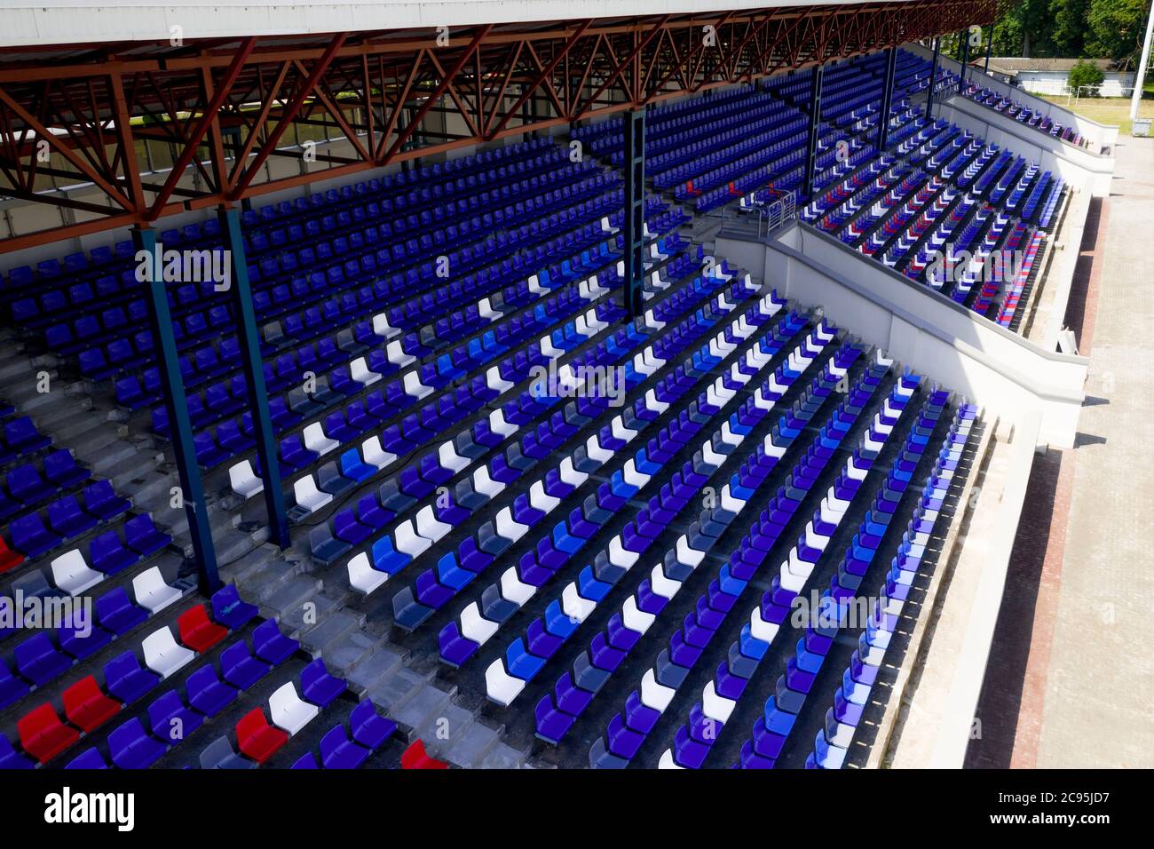 Top view of empty football stands in a large football stadium. Stock Photo