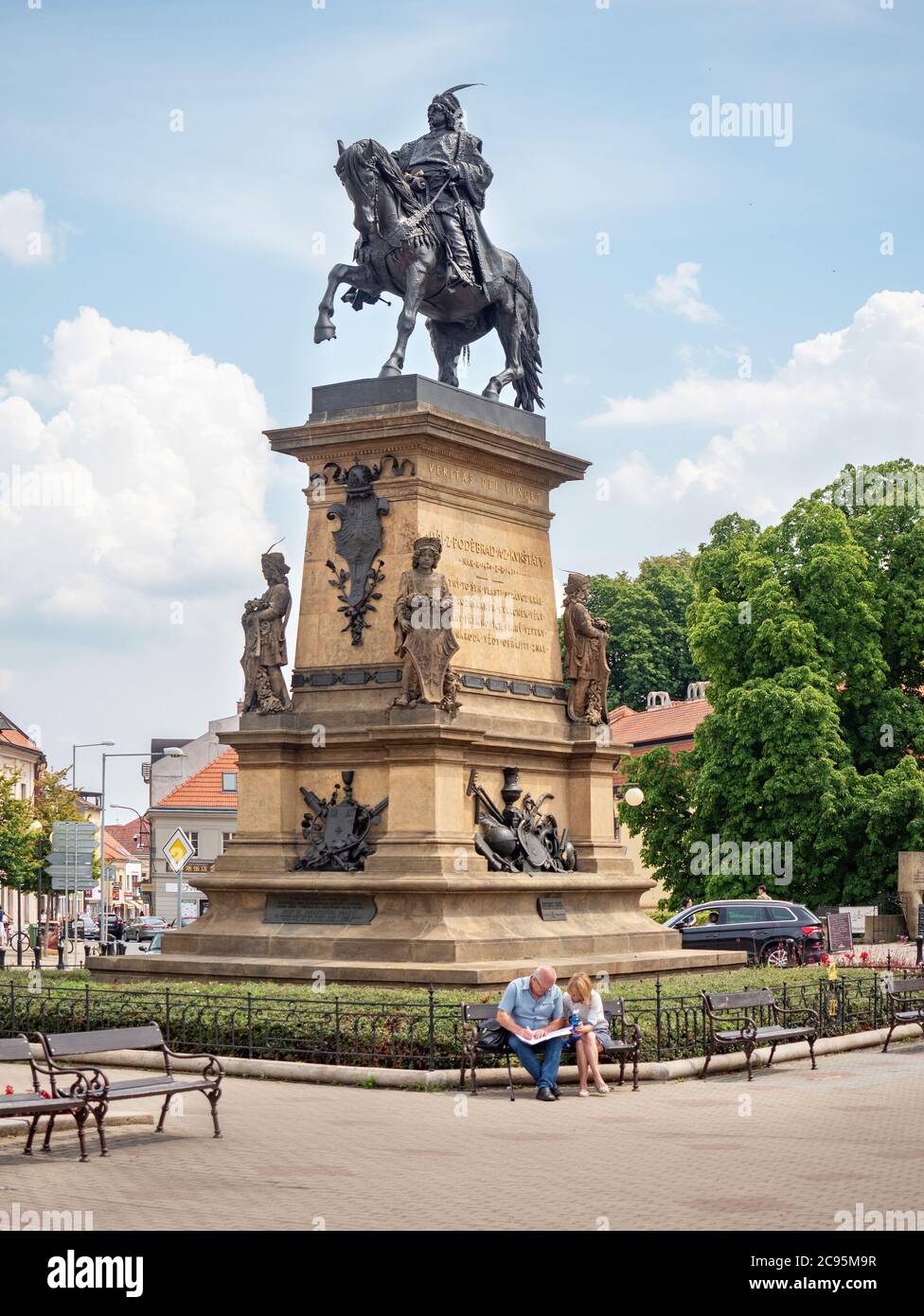 July 20th 2020, Podebrady, Czechia. Tourists check map bellow statue of King George of Podebrady on square his name Stock Photo