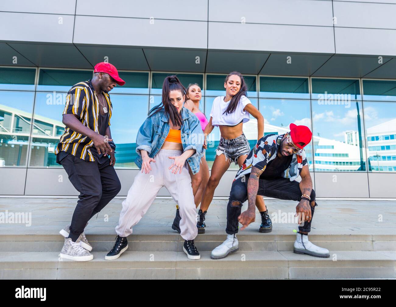 Hip hop crew dancing Multiracial group of people having fun outdoors