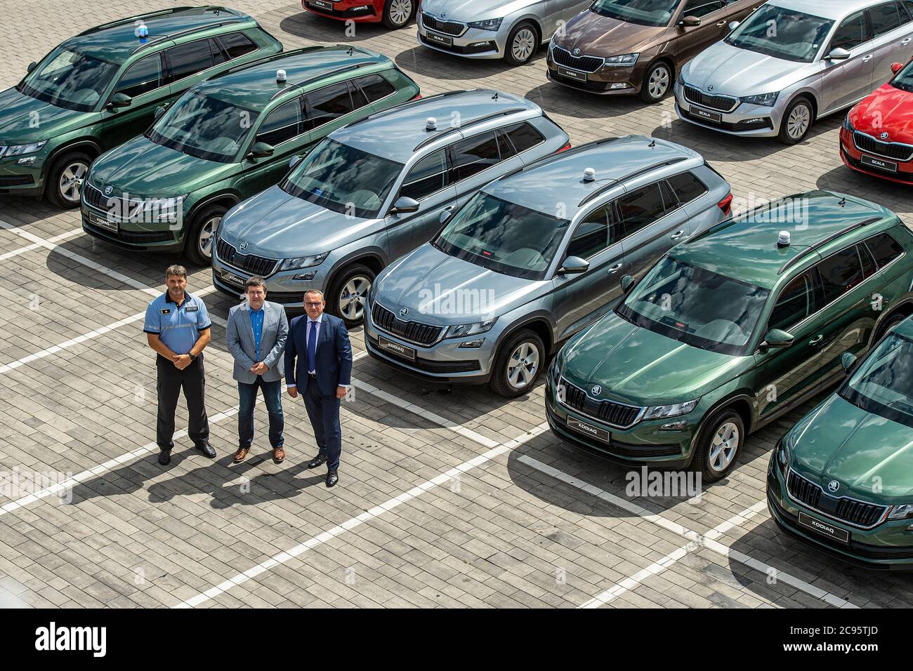 Mlada Boleslav, Czech Republic. 28th July, 2020. Czech Interior Ministry took over the first 35 cars by Skoda Auto in Mlada Boleslav, Czech Republic, on July 28, 2020. In the next three years, the office will receive almost 3,300 cars that will be used by various departments of the ministry, most of them by the police, but also firefighters or administrative departments. On the phoro are seen L-R Police President Jan Svejdar, Interior Minister Jan Hamacek and Skoda Auto's head for Czechia Lubos Vlcek. Credit: Radek Petrasek/CTK Photo/Alamy Live News Stock Photo