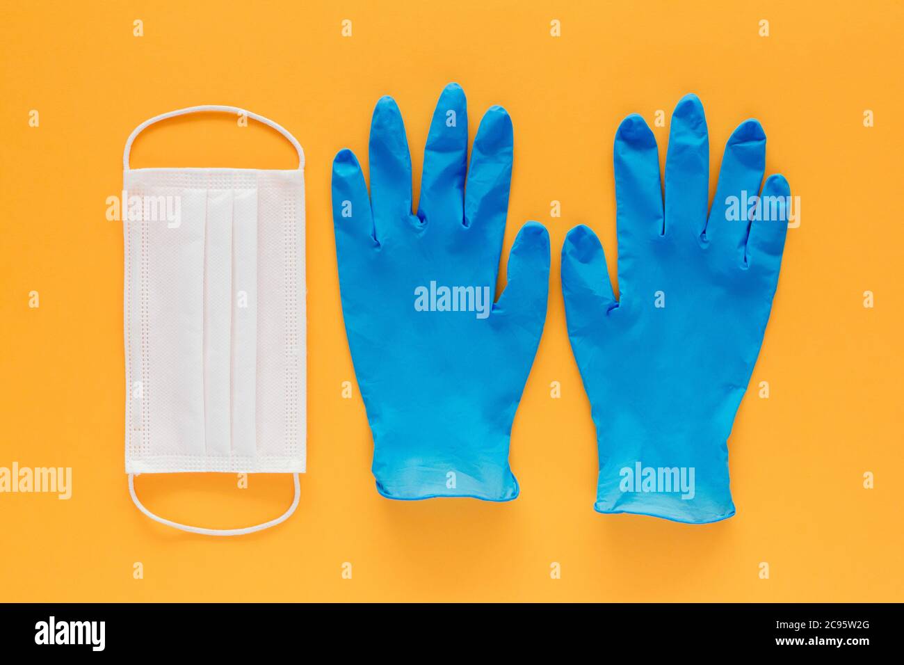 Download Stock Photo Of A Face Mask And A Pair Of Blue Latex Gloves On A Yellow Background Coronavirus Prevention Stock Photo Alamy PSD Mockup Templates