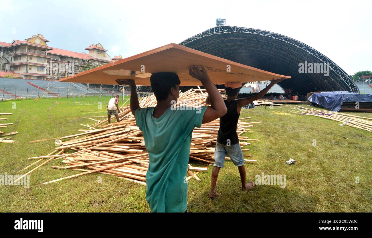 Guwahati, India. 28th July, 2020. Workers set up a temporary COVID-19 care center at the Nehru Stadium in Guwahati of Assam, India, July 28, 2020. India's COVID-19 tally crossed the 1.5 million-mark on Wednesday, reaching 1,531,669, the federal health ministry said. Credit: Str/Xinhua/Alamy Live News Stock Photo