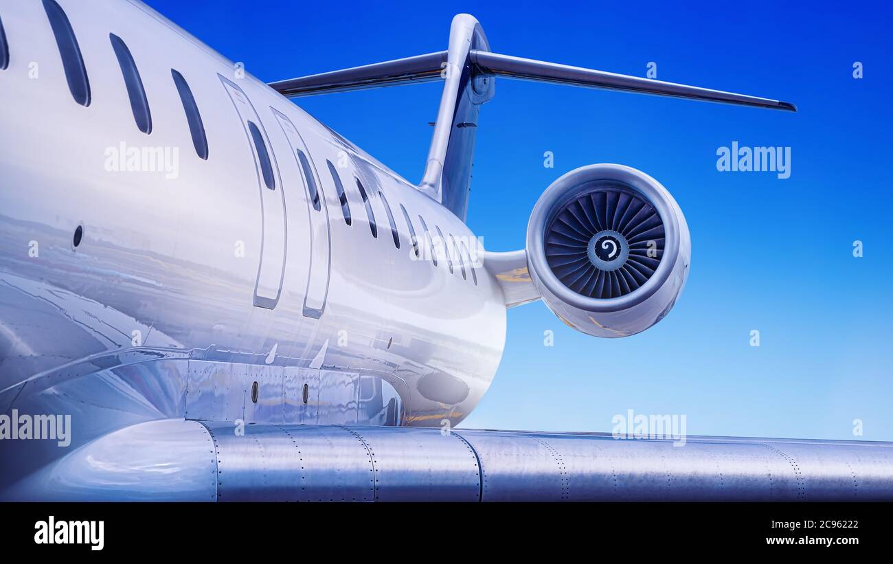 private jet against a blue sky Stock Photo