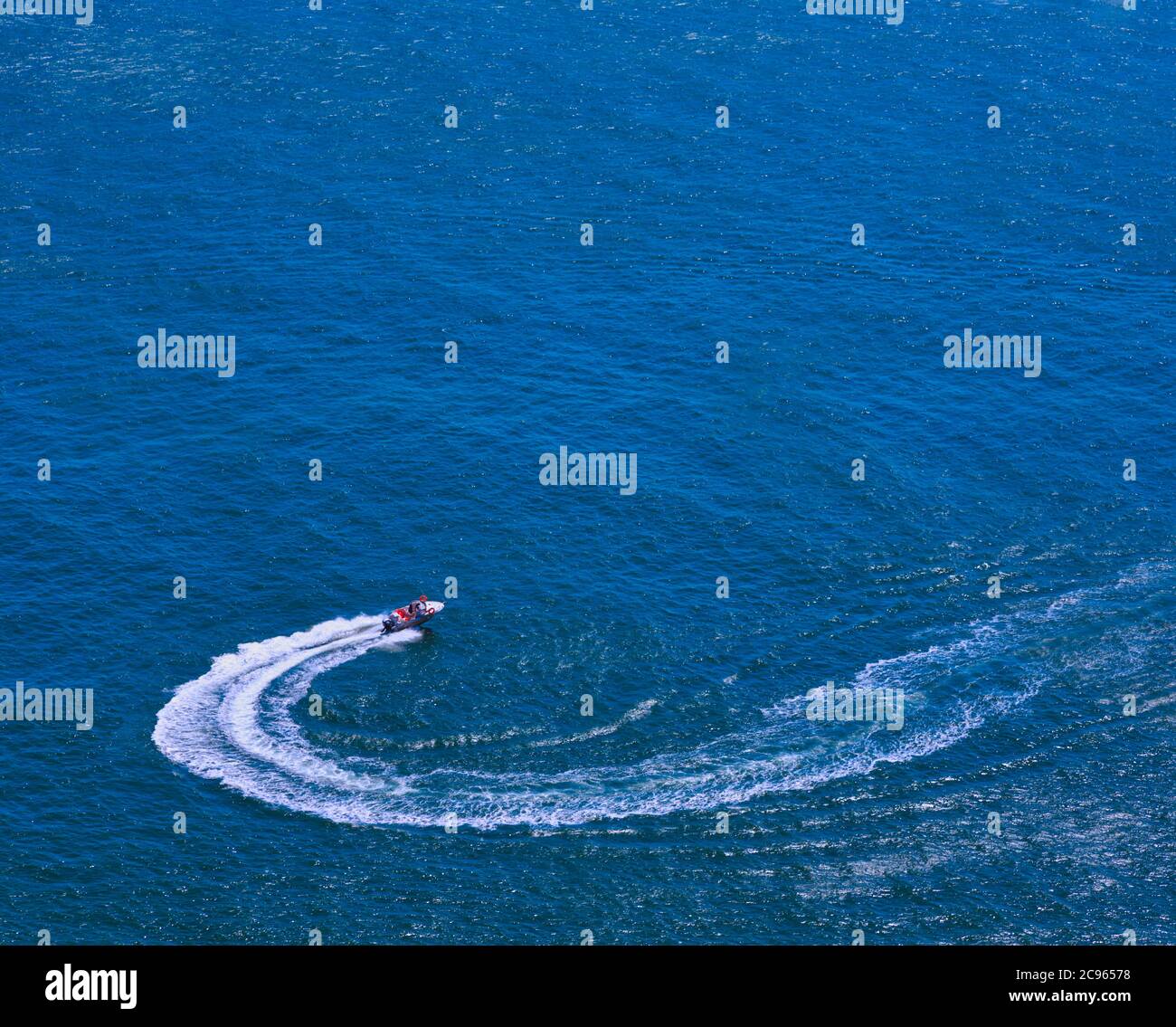 Speedboat circling in the sea. Stock Photo