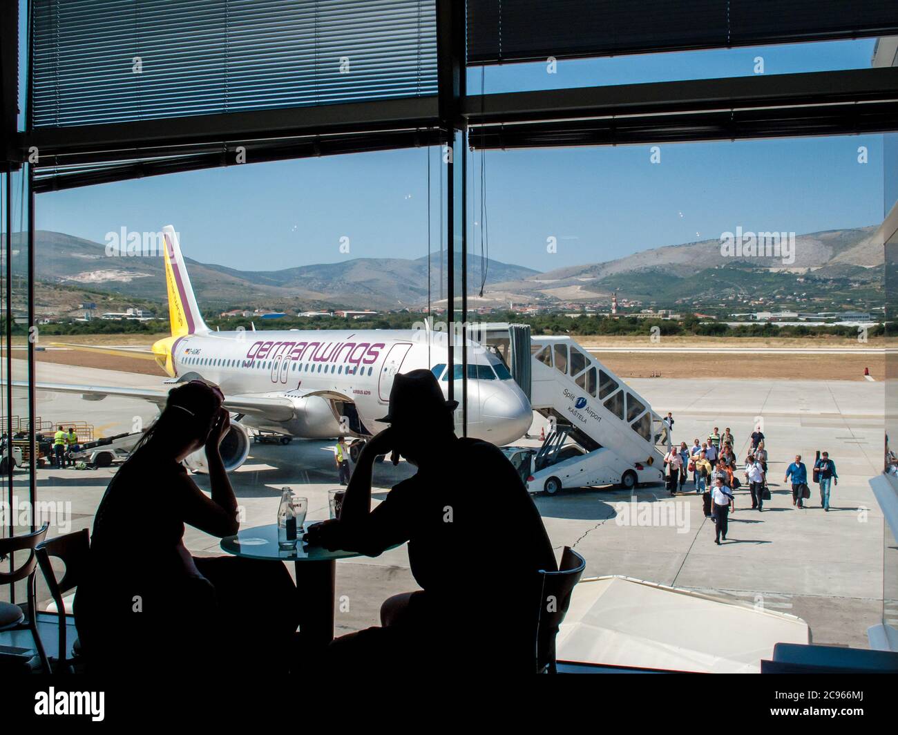 Split, Dalmatia, Croatia - Holidaymakers disembark at Split airport from an aircraft of the German airline germanwings. Stock Photo