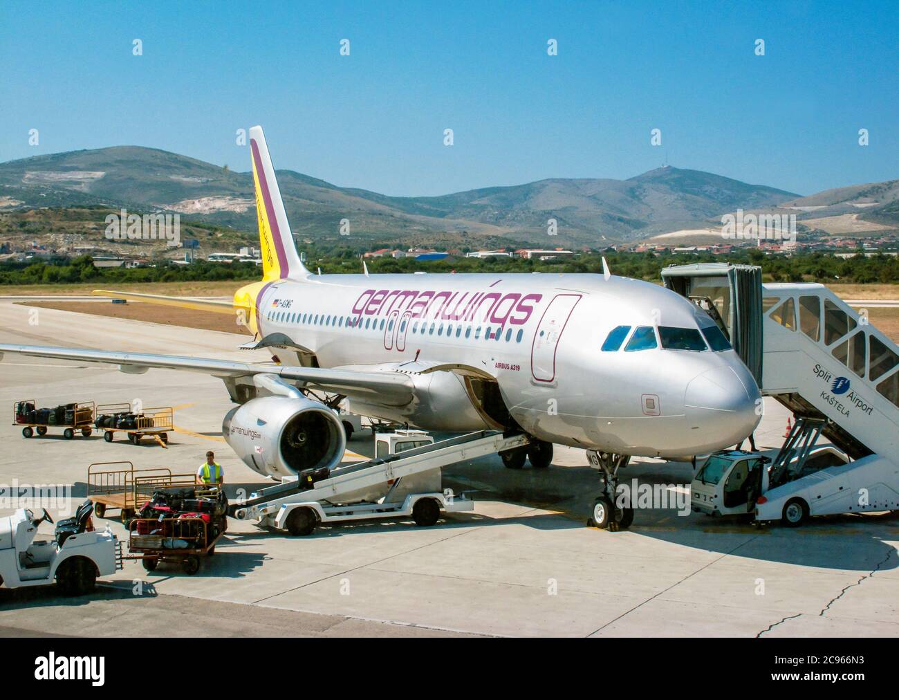Split, Dalmatia, Croatia - At Split airport, luggage is loaded onto an aircraft of the German airline germanwings. Stock Photo