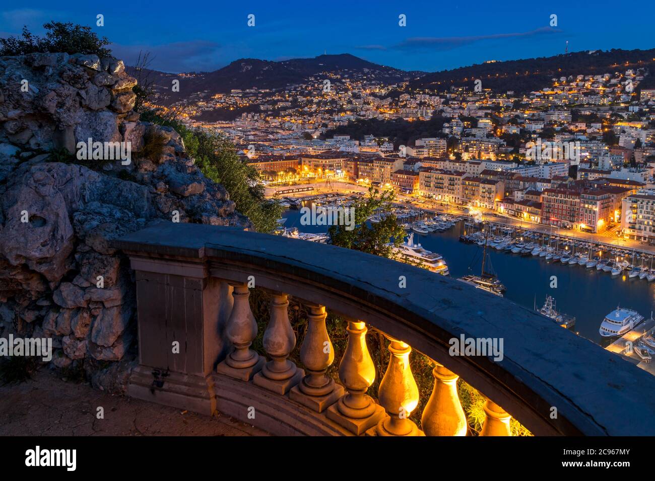 View from Colline du Chateau down to Port Lympia at dusk, Nice, Cote d'Azur, France, Europe Stock Photo