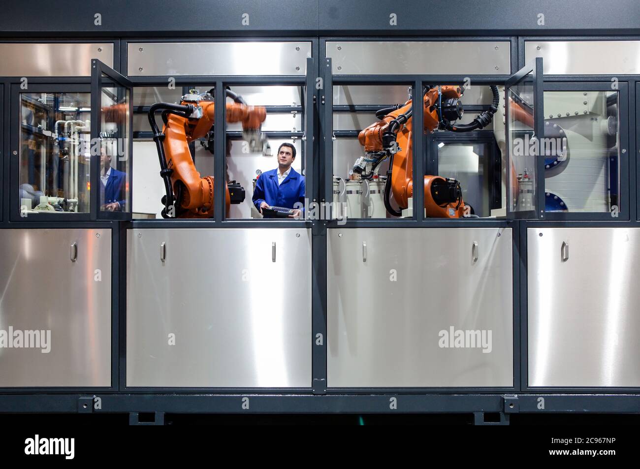 Dortmund, North Rhine-Westphalia, Germany - High Technology in the Ruhr  Area. A technician from carat robotic innovation GmbH programs an  articulated Stock Photo - Alamy