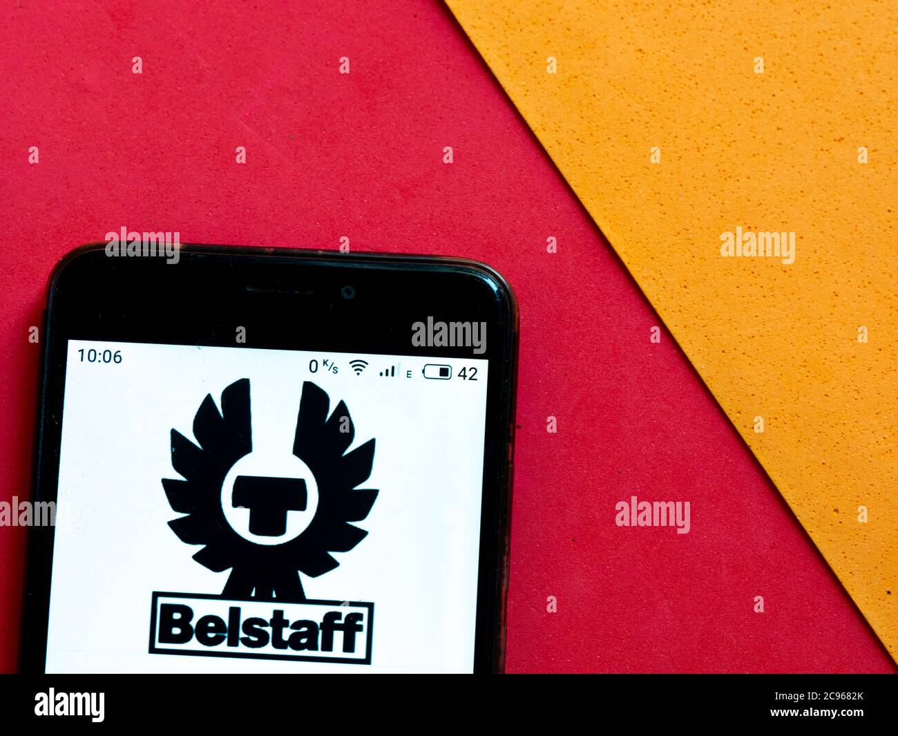 In this photo illustration a Belstaff logo is seen displayed on a smartphone. Stock Photo