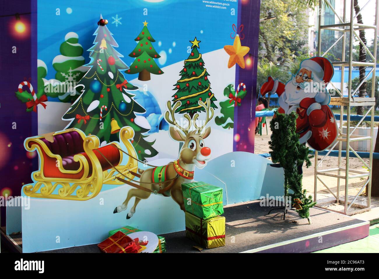 Kolkata, West Bengal/India - December 29, 2019: Cropped View of Santa Claus and Christmas tree and colorful gift boxes for Christmas decoration at Par Stock Photo