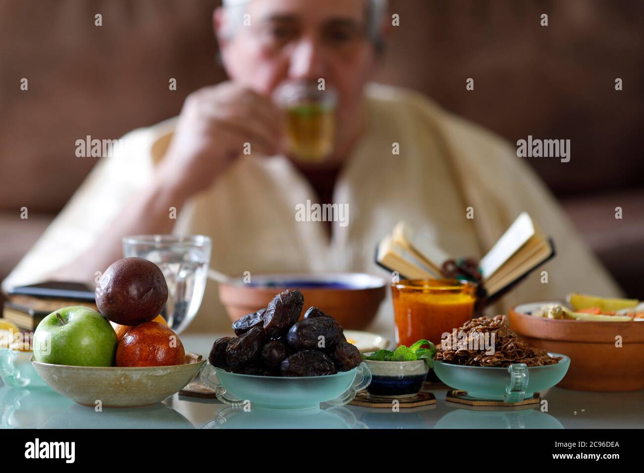 Traditional meal for iftar in time of Ramadan after the fast has been broken.  Muslim drinking tea.  France. Stock Photo