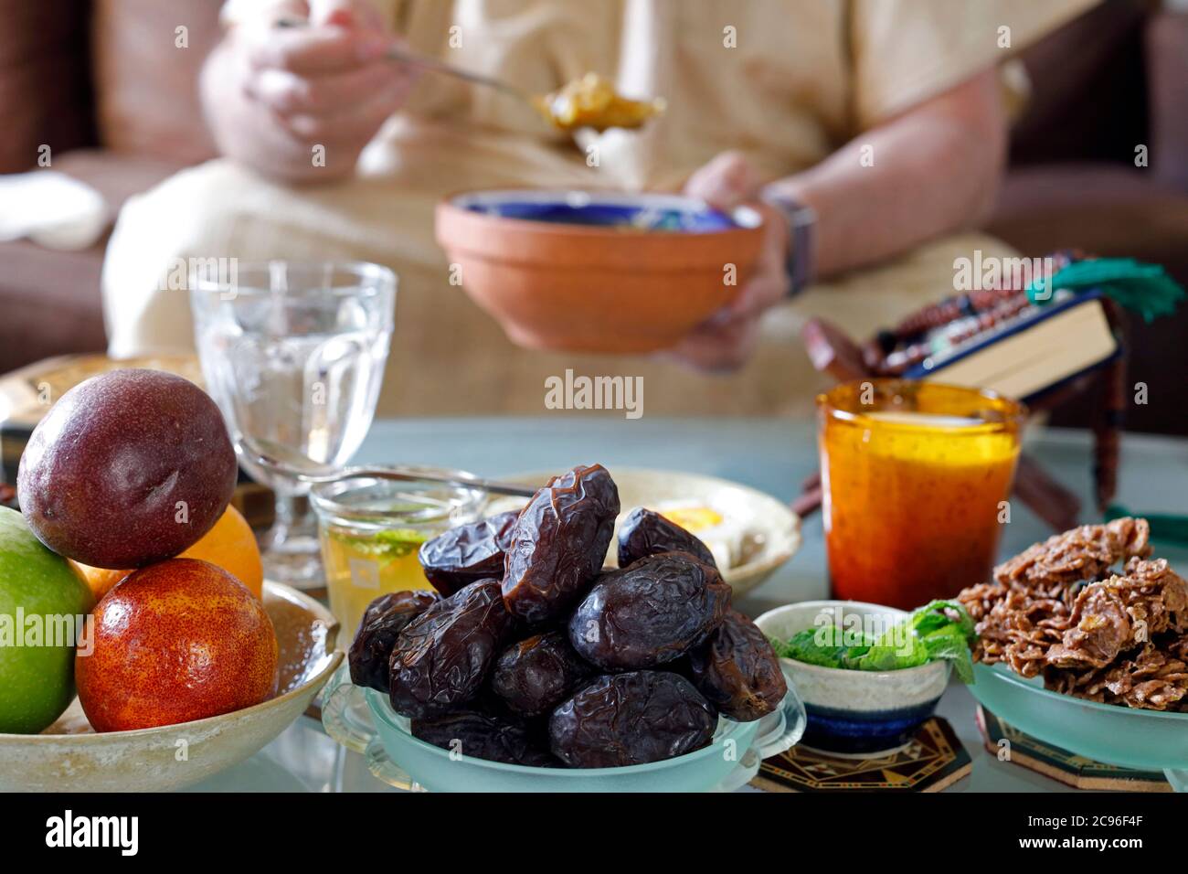 Traditional meal for iftar in time of Ramadan after the fast has been broken.  Muslim eating.  France. Stock Photo