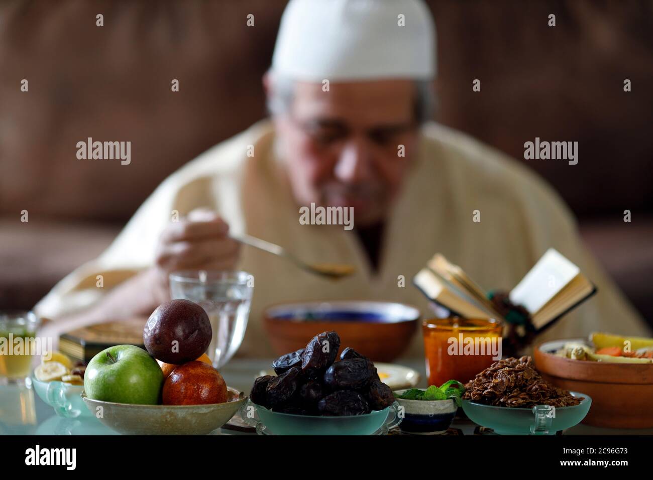 Traditional meal for iftar in time of Ramadan after the fast has been broken.  Muslim eating.  France. Stock Photo