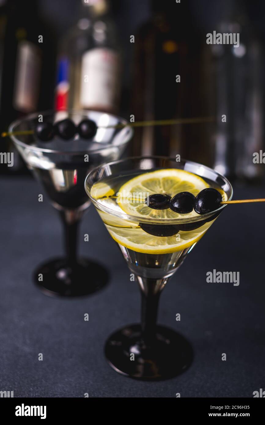 Alcohol cocktail with splash.Dry martini with black olives.Vermouth