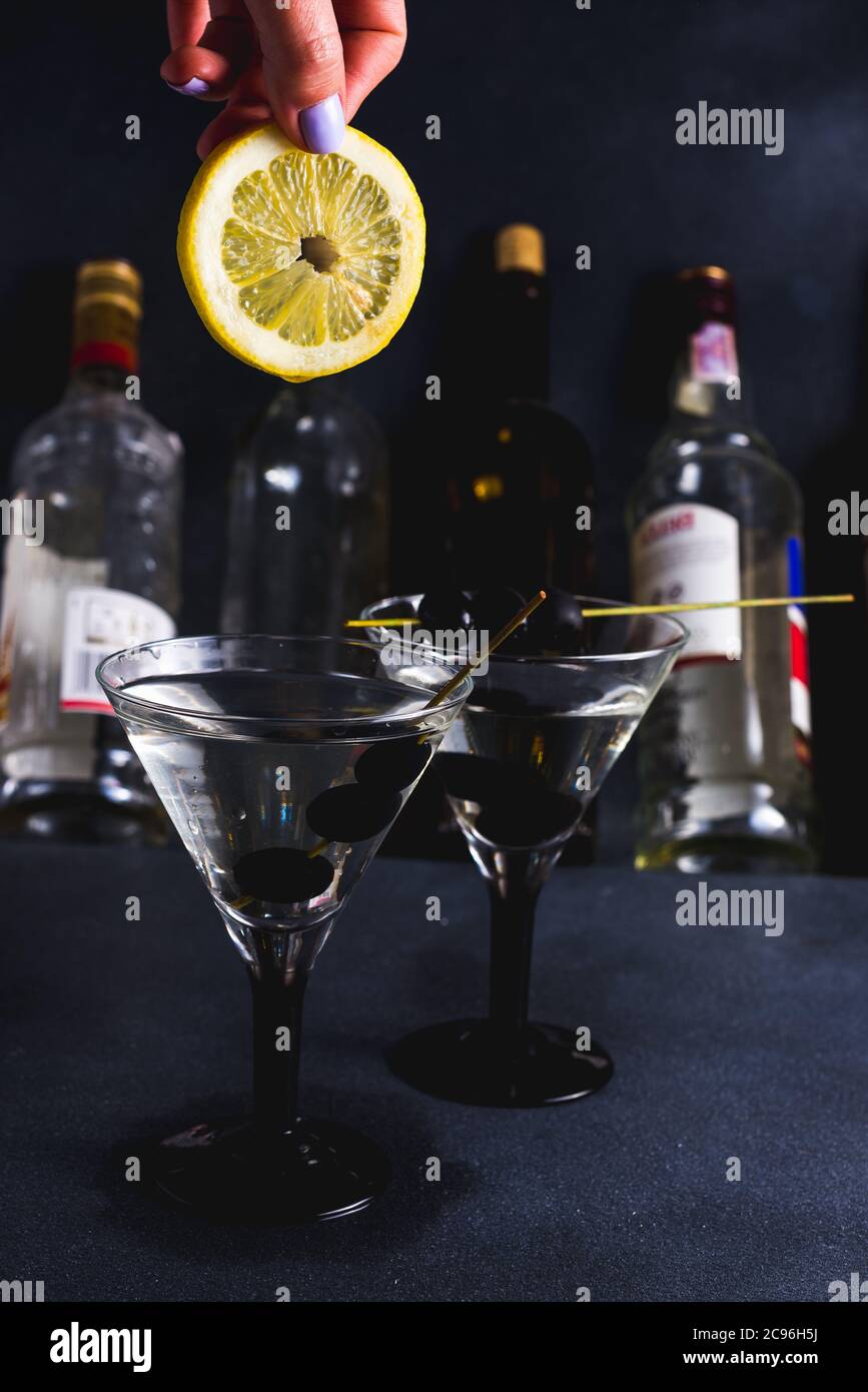 Alcohol cocktail with splash.Dry martini with black olives.Vermouth