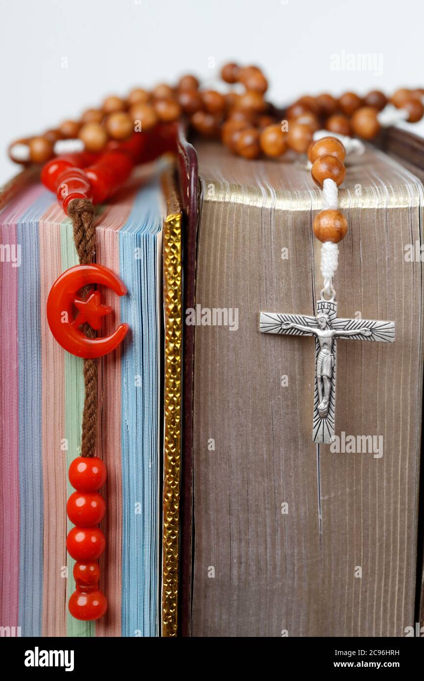 Religious symbols. Quran, bible and prayer beads. Christianity, Islam. Interfaith dialogue.  France. Stock Photo
