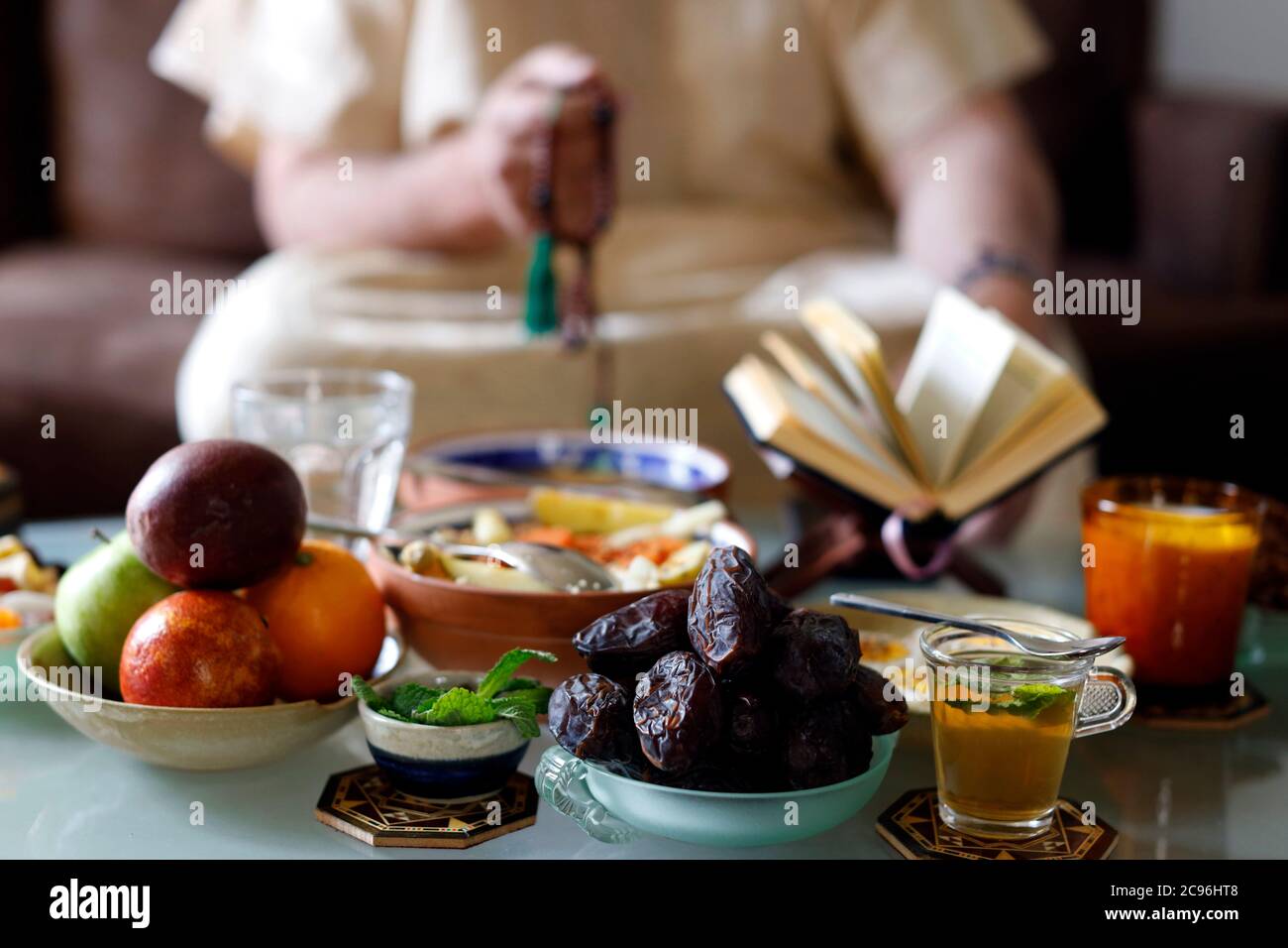 Traditional meal for iftar in time of Ramadan after the fast has been broken.  Muslim praying.  France. Stock Photo