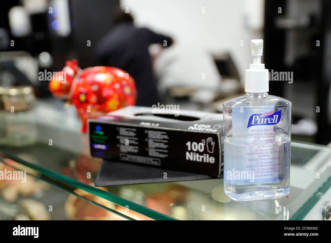 Coronavirus epidemic (COVID-19). Social distancing in a shop. Gloves and hydroalcoholic gel.  Sallanches. France. Stock Photo