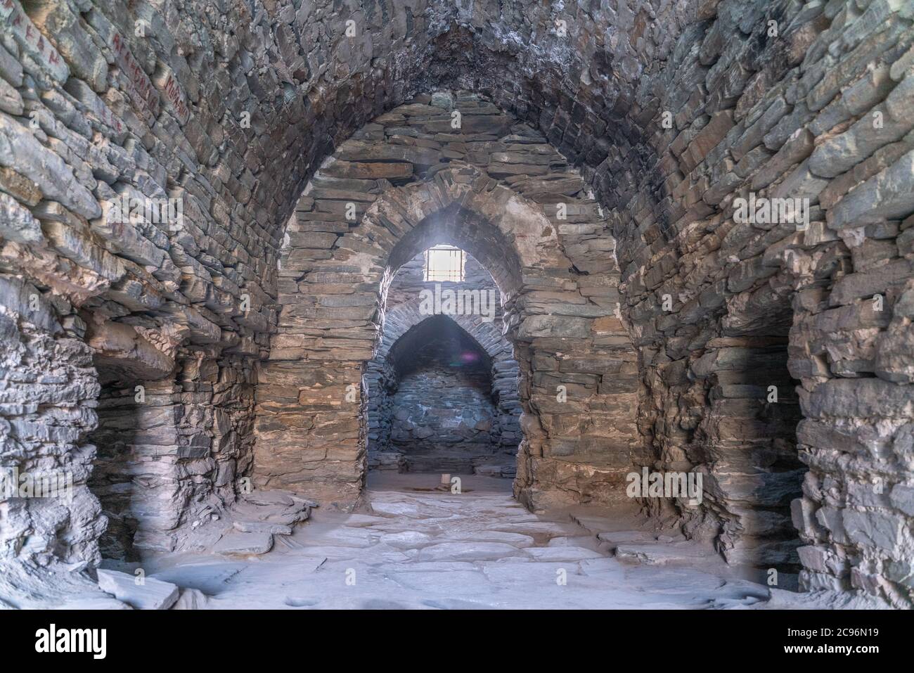 The view of interior in old stone ancient caravanserai in Tash-Rabat in Kyrgyzstan Stock Photo