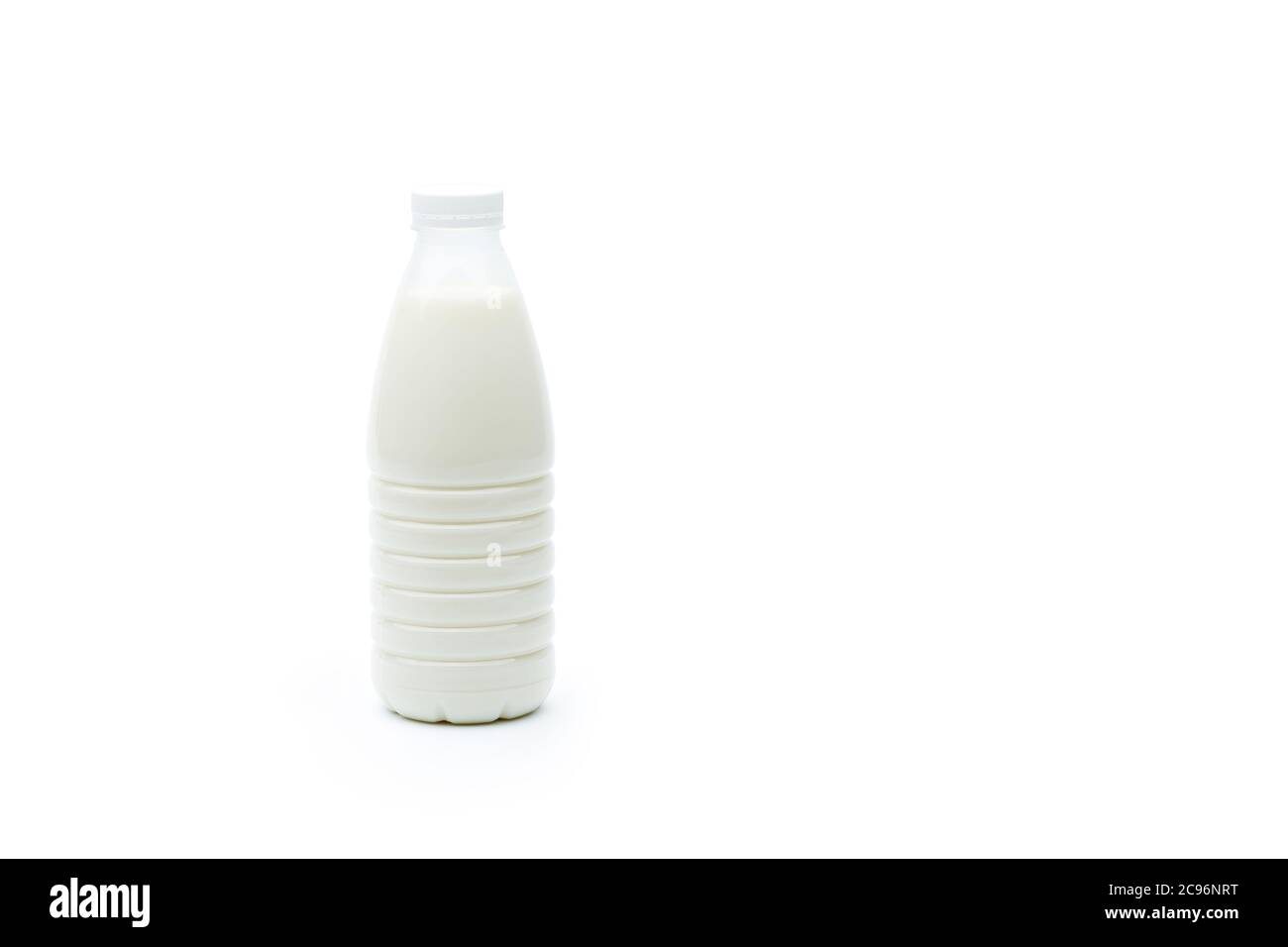 Full plastic bottle of milk isolated on a white background with copy