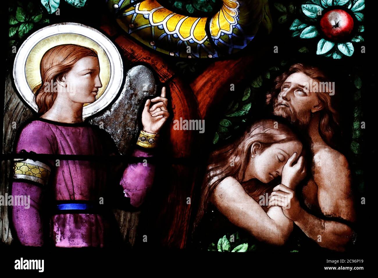 Basilica of Our Lady of Geneva.  Stained glass window. Adam and Eve driven from Paradise. Geneva. Switzerland. Stock Photo