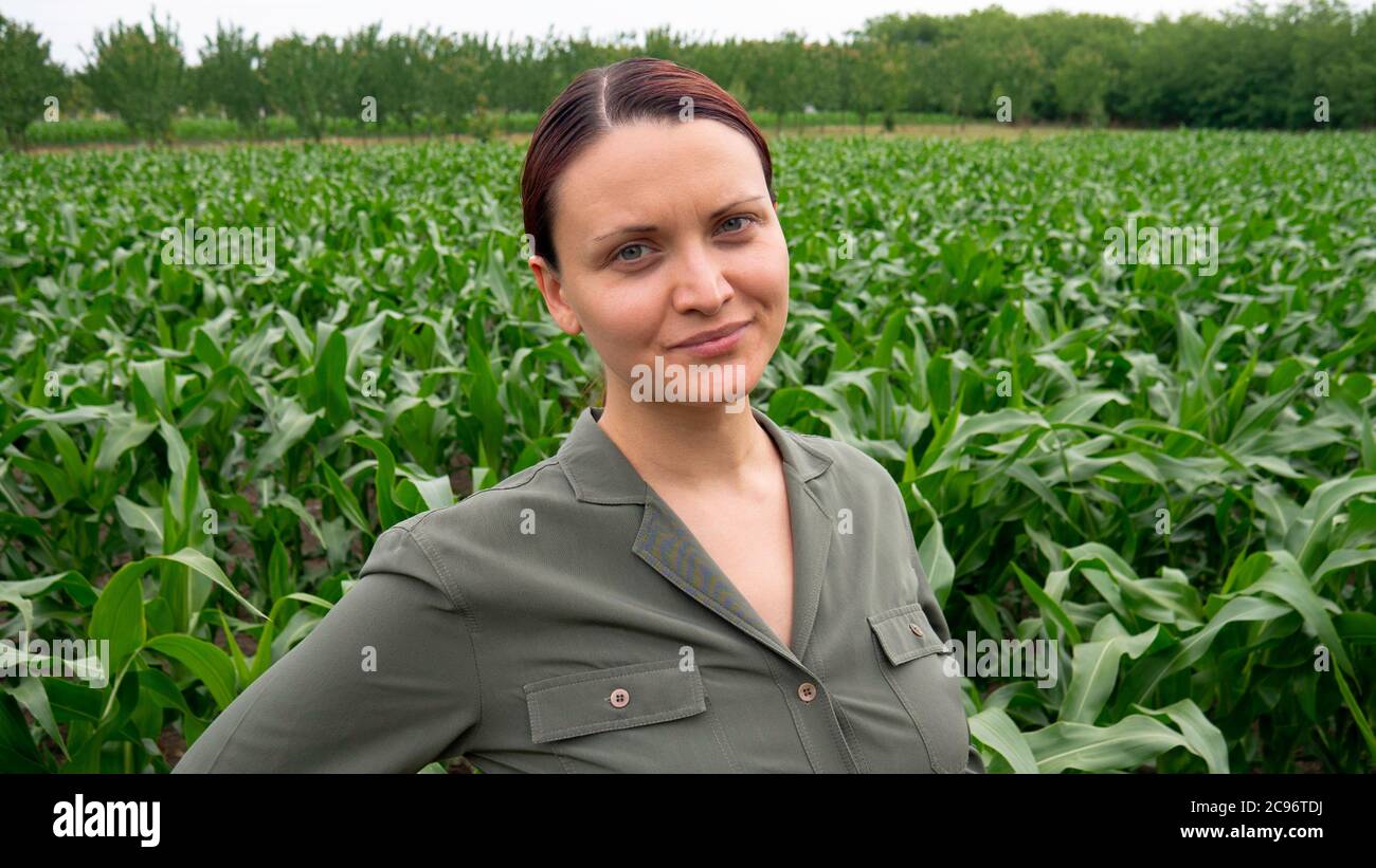Female farmer in a corn field Stock Photo - Alamy
