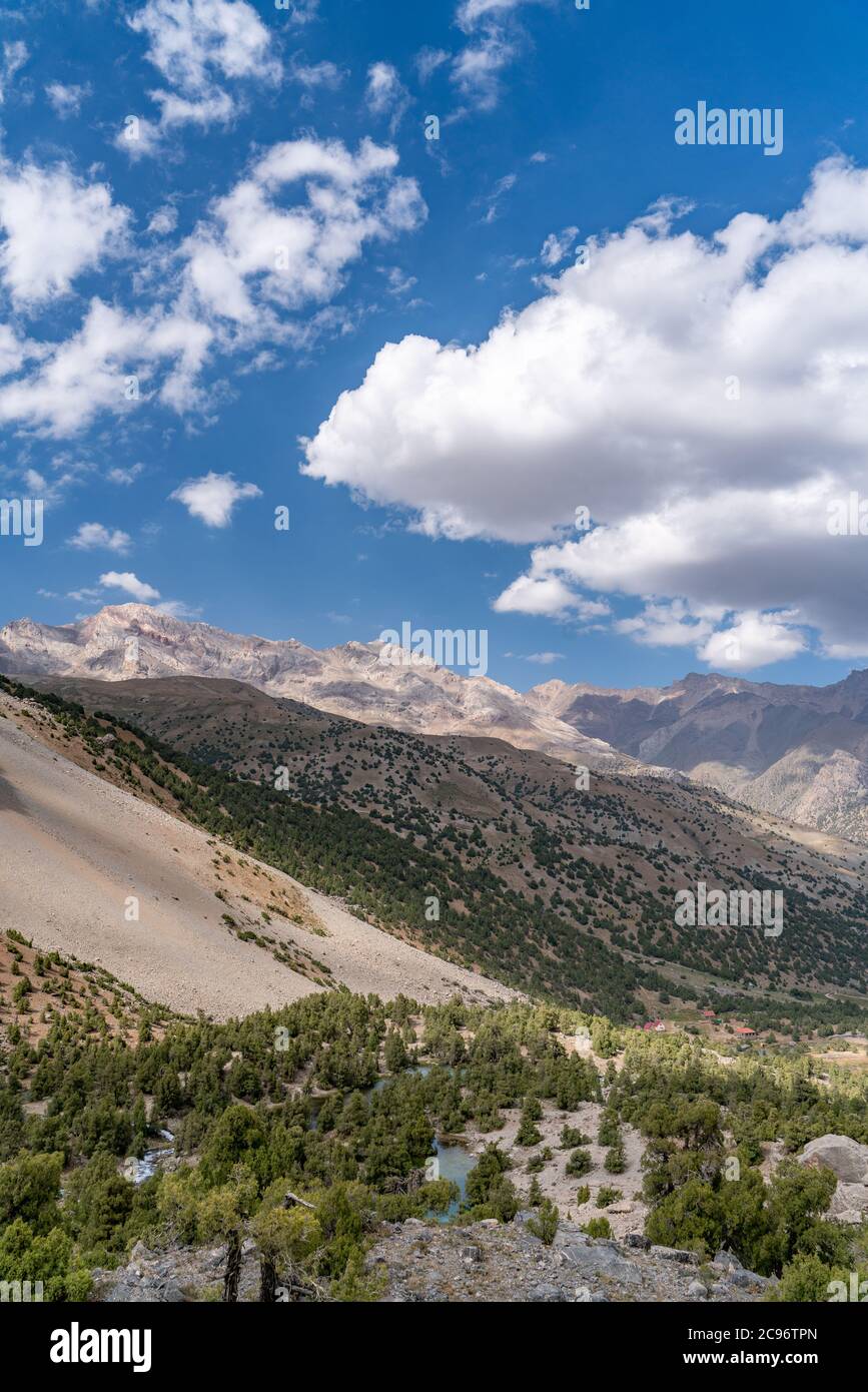 The beautiful mountain trekingtrekking road with clear blue sky and rocky hills in Fann mountains in Tajikistan Stock Photo