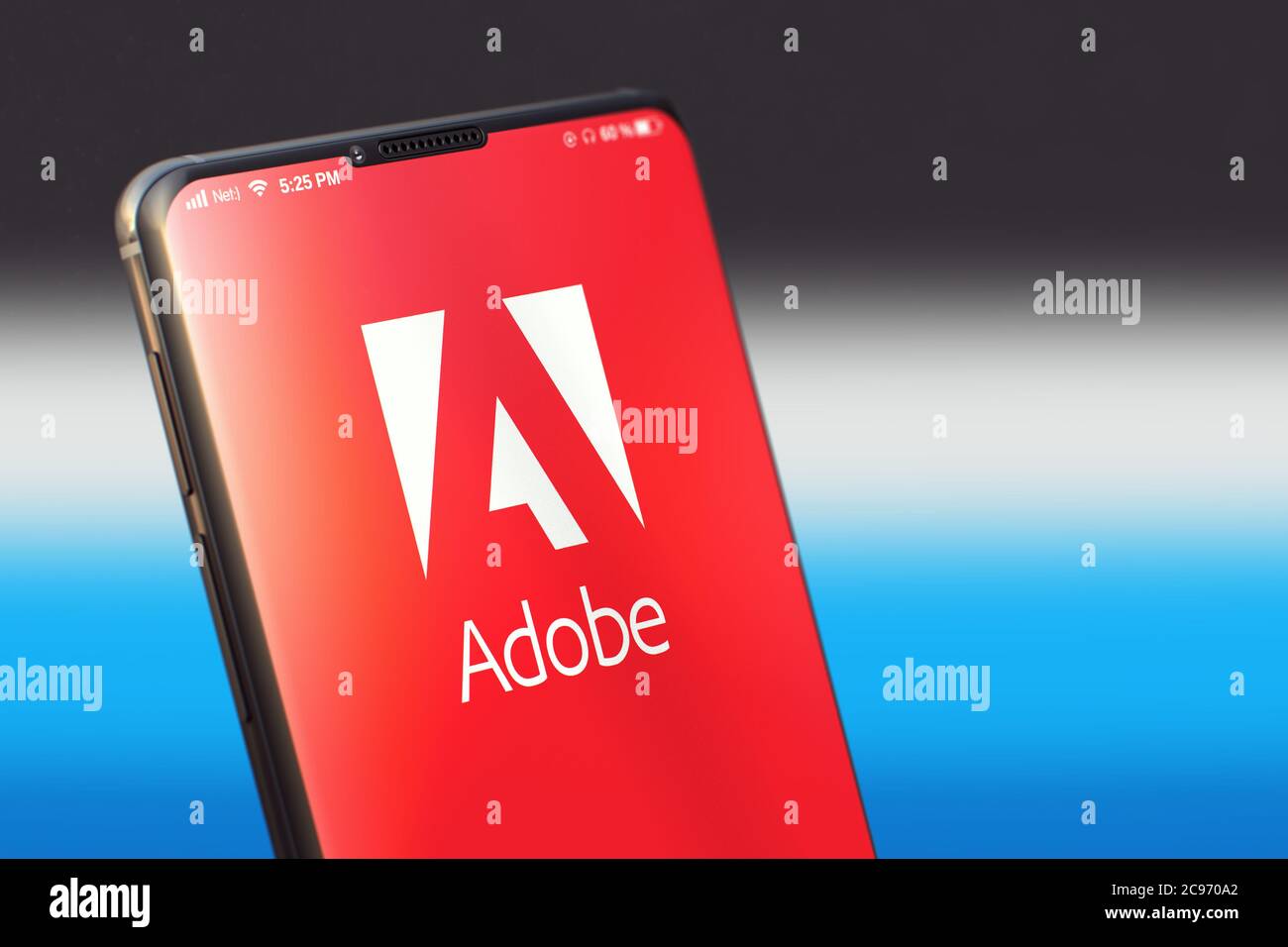 KYIV, UKRAINE-JUNE, 2020: Adobe Mobile Application on the Smart Phone Screen. Close Up Studio Shot of Smartphone with Adobe Application. Stock Photo