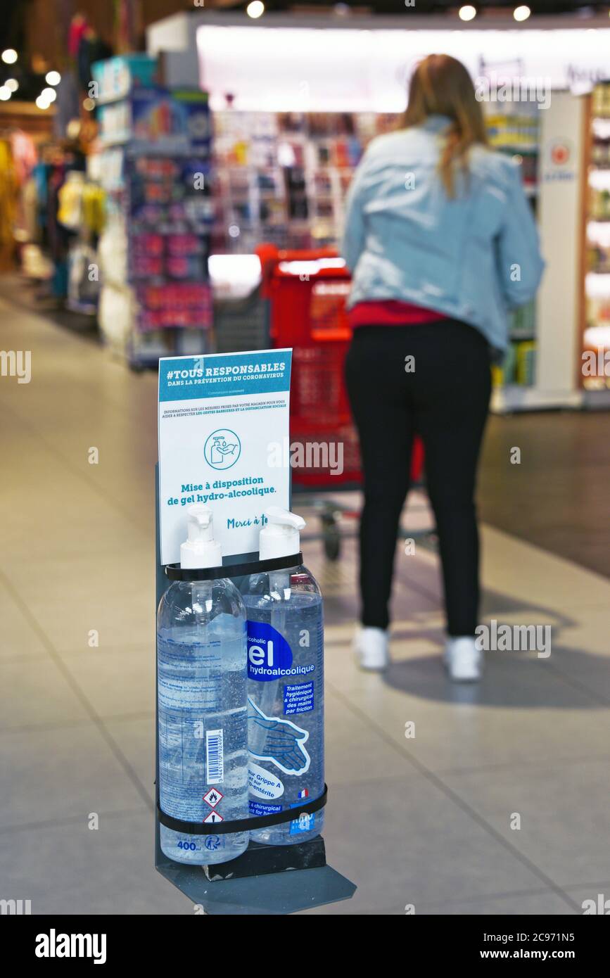 covid 19, hand disinfection in a supermarket, France, Savoie Stock Photo