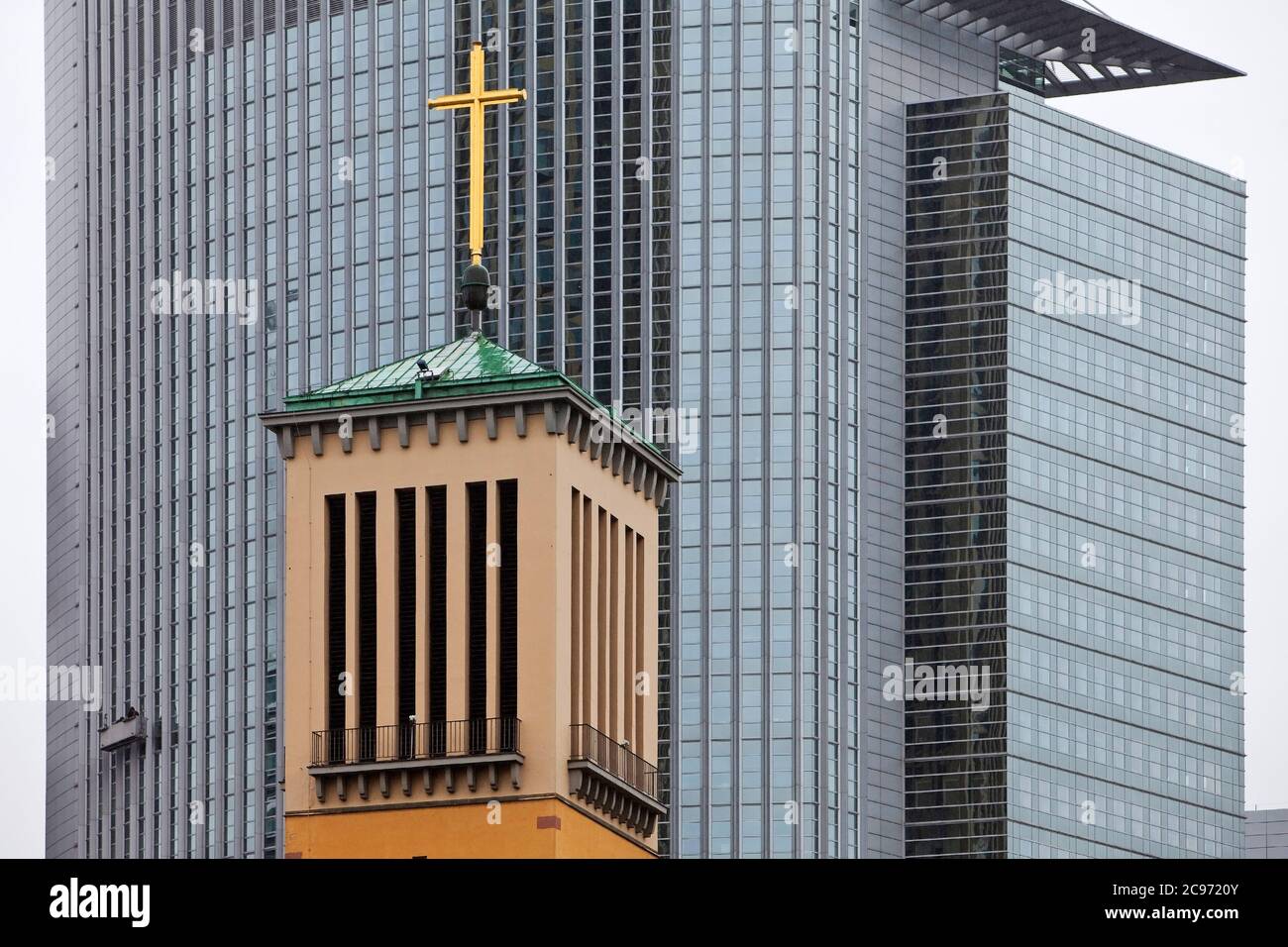 steeple of the Matthew Church in front of the modern aluminium facade of the Pollux high-rise office building, Germany, Hesse, Frankfurt am Main Stock Photo