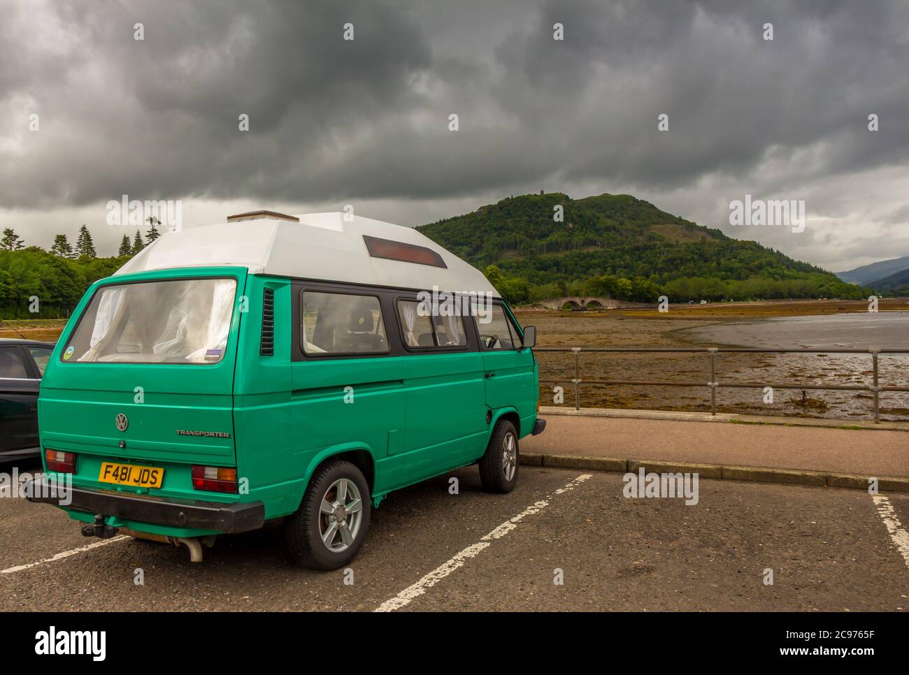 Inveraray, Scotland - July 14th 2016: An old Volkswagon T3 Transporter parked in Inveraray harbour by Loch Fyne at low tide, Argyll, Scotland Stock Photo