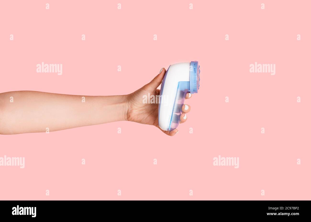 https://c8.alamy.com/comp/2C97BP2/female-hand-showing-electric-massager-over-pink-background-closeup-2C97BP2.jpg