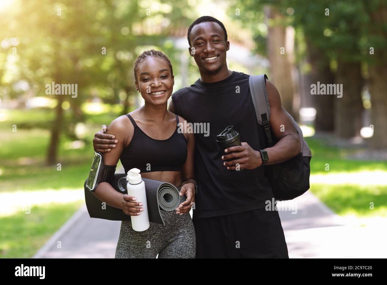 Fit Black Couple In Sportswear Posing Together After Training Outdoors In  Park Stock Photo - Alamy