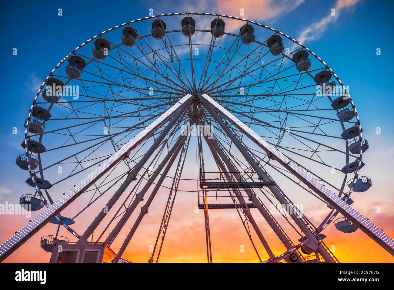 Ferris Wheel with sunset sky and clouds Stock Photo - Alamy