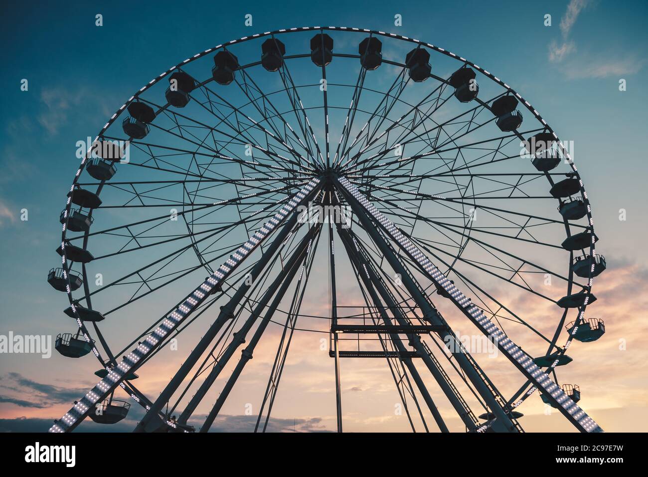 Ferris Wheel with sunset sky and clouds Stock Photo - Alamy