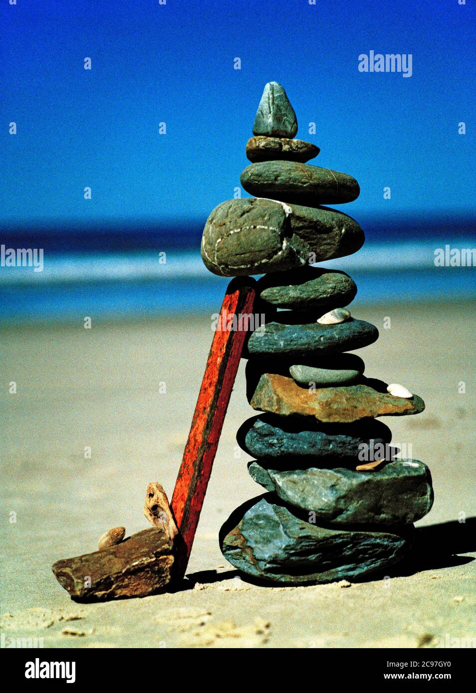 Beach stones and driftwood cairn on Broken Head Beach Nature Reserve near Byron Bay Stock Photo