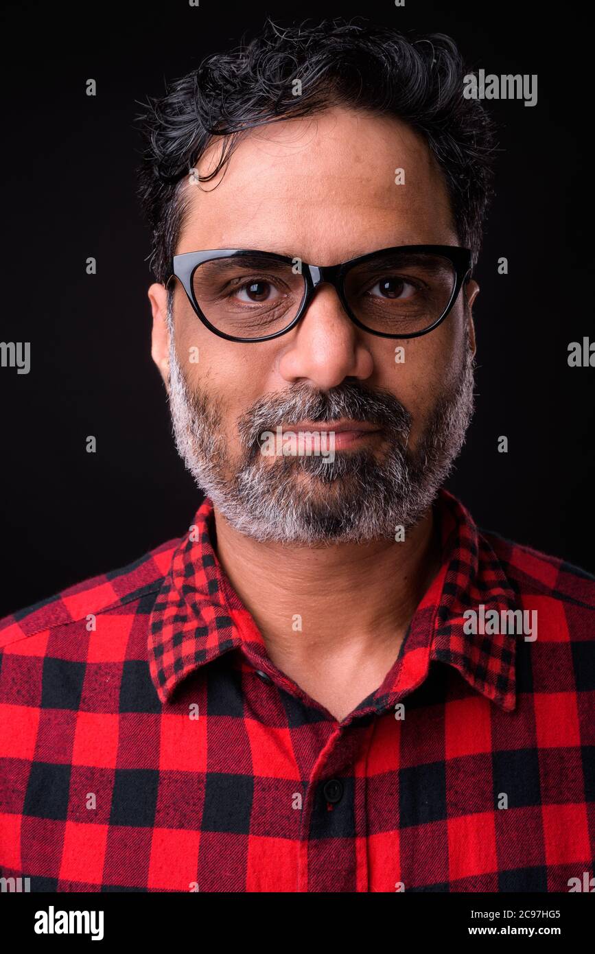 Portrait of mature bearded Indian hipster man Stock Photo