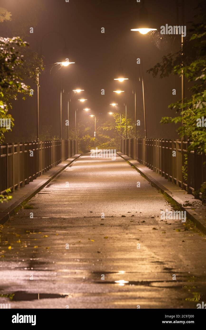 Moody bridge with hazy air at night in Fussen, Germany. Stock Photo
