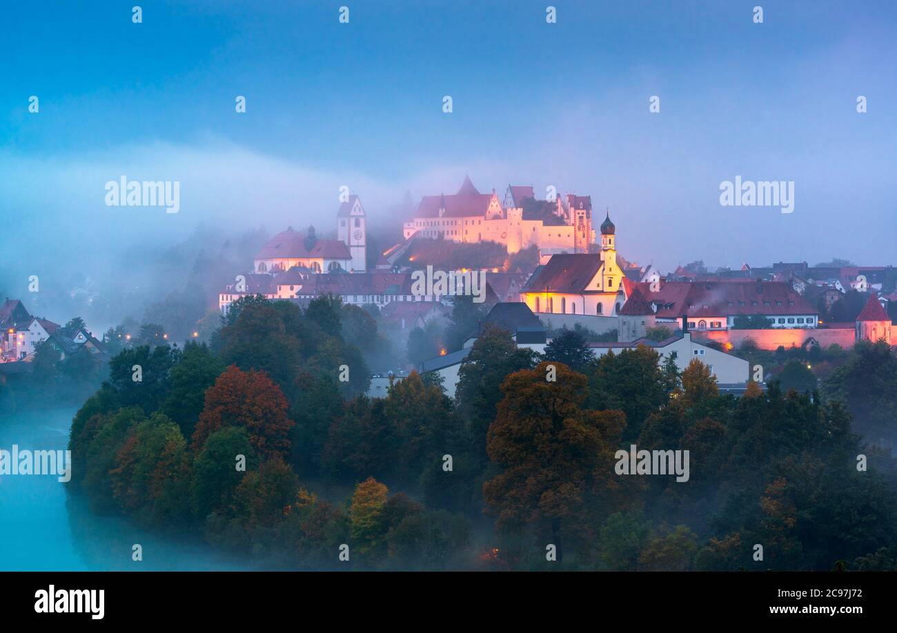 Fussen, Germany old town on the Lech River during a foggy twilight. Stock Photo