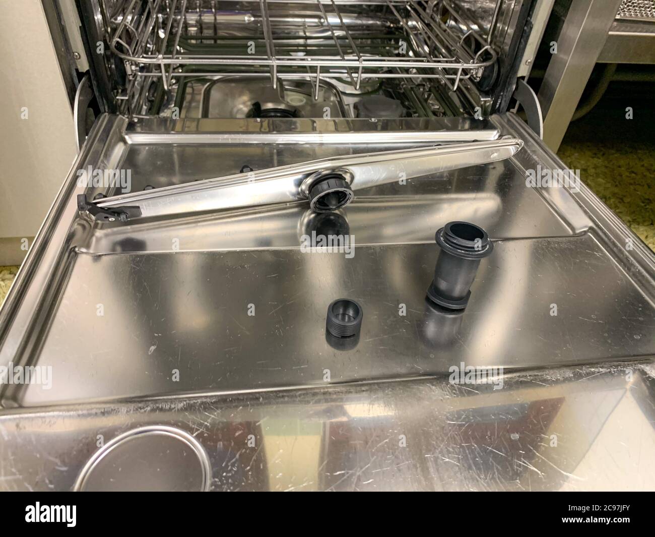 in a dishwasher one of the washing arms is broken Stock Photo Alamy