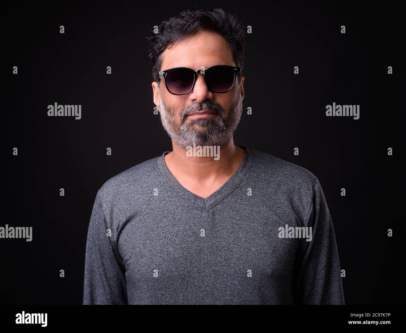 Portrait of mature bearded Indian man with curly hair Stock Photo - Alamy